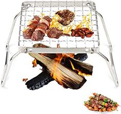 a grill with meats and vegetables cooking on it next to a pile of food