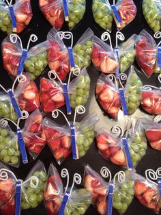 grapes and strawberries are wrapped in plastic bags