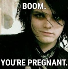 a young man with long hair wearing a suit and tie that says boom you're pregnant