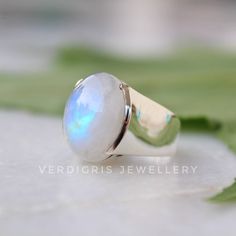 Alternative engagement ring, rainbow moonstone ring, moonstone jewellery, floral Ring, Sterling Silver ring, cocktail ring, avant garde ring Description: Stand out of the crowd with this lovely natural rainbow Moonstone ring on your finger. The design is simple and adds to the elegance of this beautiful stone. The color of the gemstone is such that it will go well with all attires. I make the gemstones myself for my valued customers so I assure you that the gemstones are Natural and are made fro White Oval Cabochon Moonstone Ring, Unique Opal Ring With Moonstone, White Cabochon Moonstone Ring In Fine Jewelry Style, Fine Jewelry White Cabochon Moonstone Ring, White Cabochon Moonstone Ring Fine Jewelry, White Moonstone Ring With Oval Cabochon, White Oval Cabochon Moonstone Ring With Gemstone, Hallmarked Moonstone Ring For Anniversary, Handmade Oval Moonstone Ring In Modern Style