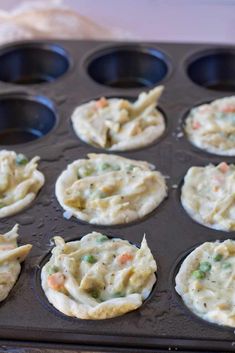 some food is sitting in a muffin tin