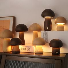 a bunch of mushrooms sitting on top of a wooden table next to a book shelf