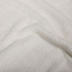 an image of a white blanket that is very soft and plushy to it's surface