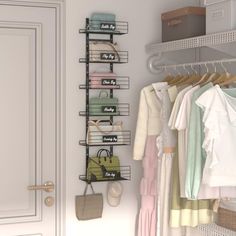 an organized closet with clothes and handbags hanging on the rack, next to a white door