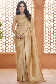 Step into timeless elegance with this Traditional Banarasi Silk Saree crafted from the finest Pure Banarasi Silk. The rich texture of the saree is enhanced with intricate Weaving Work, offering a regal appeal that’s perfect for any special occasion. Paired with a luxurious Silk Blouse, this ensemble ensures you exude sophistication at every function.Whether it’s a wedding, reception, or festive celebration, this saree is the epitome of classic charm and grace. Please note that slight color varia Saree For Women Indian, Cream Saree, Banarasi Sari, Reception Saree, Peach Saree, Indian Saree Blouse, Indian Party Wear, Banarasi Silk Saree, Art Silk Sarees