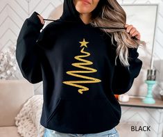 Christmas Gift Sweatshirt, Merry Xmas Gift Hoodie, Christmas Hoodies for Women, Xmas Party Hoodie, Pine Trees Hoodie HOW TO ORDER: 1. Please, Check and Review all Photos and Size Charts (All styles are Unisex) 2. Choose Your Color/Size 3. Choose Your Quantity as much as you want. 4. Click "Add To Cart". For multiple items go back to the listing and repeat the steps. *QUALITY: Sweatshirts (no hood) & Hoodies (with hoods), both styles are soft & comfy. They are UNISEX size, fitting men and women! Casual Black Christmas Hoodie, Winter Gift Hooded Sweatshirt, Hooded Winter Sweatshirt Gift, Winter Gift Hooded Hoodie, Winter Hooded Hoodie As Gift, Hooded Winter Hoodie As Gift, Black Sweatshirt Winter Gift, Black Hooded Christmas Hoodie, Black Christmas Hoodie