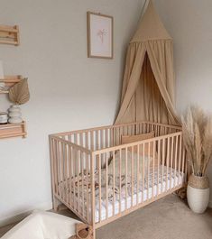 a baby's crib in the corner of a room