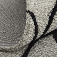 closeup of the black and white knitted fabric on a sweater that has been worn by someone