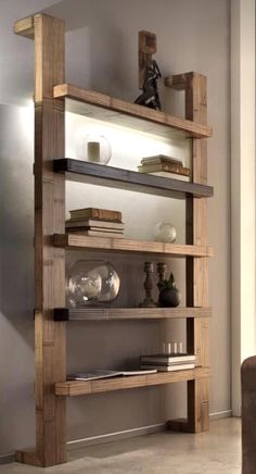 a wooden shelf with glass shelves in the middle and bookshelves on each side