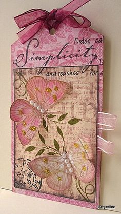 a card with pink flowers on it and a ribbon around the edge that says congratulations