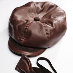 If you are searching for ways to stand out in the crowd with your look,then a Newsboy Cap is what you are looking for. Leather hat can attract a great visual interest  to your appearans.It adds instand personality to a look.The brown cap is the ultimate partner for a fashionable styling for the season. Genuine leather,cotton lining. M-56cm L-58cm Brown For men Brown Adjustable Baseball Cap For Fall, Classic Brown Baseball Cap For Winter, Adjustable Brown Baseball Cap For Fall, Classic Brown Baseball Cap One Size Fits Most, Classic Brown Hat With Leather Sweatband, Brown Flat Cap One Size Fits Most, Adjustable Brown Baseball Cap With Short Brim, Classic Brown Baseball Cap, One Size Fits Most, Retro Brown Baseball Cap With Short Brim