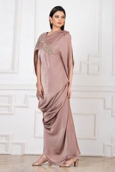 Brown gown with front drape and placed floral pearl applique embellishment. - Aza Fashions Pre-draped Evening Gown With Traditional Drape, Evening Gown With Traditional Pre-draped Style, Evening Gown With Pre-draped Traditional Drape, Embellished Draped Wedding Gown, Traditional Drape Dress With Draped Sleeves For Reception, Reception Dress With Traditional Draped Sleeves, Formal Dress With Traditional Draped Sleeves, Formal Dress With Draped Sleeves, Festive Floor-length Dress With Draped Sleeves