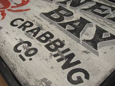 an old wooden sign with the words crabbing on it