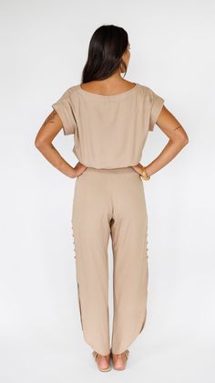 Take a walk on the chic side in the radiant Khush Clothing Haven Pant. Featuring a relaxing smocked-waist for an easy, comfortable fit, charming round bottom hem and side slits finished with covered button detail. These delightful pants will be an easy go-to for relaxed, sophisticated and a little boho. Paired here with the Mareva Top in Latte. ** Our Model is 5'8" and wearing a size SMALL. ** Fabric and Care Instructions: *100% Rayon *Hand wash cold * Line Dry Retail Boutique, Humble Beginnings, Casual Jewelry, Take A Walk, Signature Jewelry, Easy Going, Jewelry Maker, The Chic, Walk On