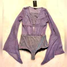 Please See Photos For Measurements. Any Questions On Measurements Please Feel Free To Inquire. Unattached Tube Top That Zips On The Back Side. Glitter And Shimmer! Is In New With Tags Condition. Glamorous Long Sleeve Bodysuit For Summer, Trendy Purple Bodysuit For Party, Trendy Purple Party Bodysuit, Trendy One-piece Top For Party, Spring Party One-piece Top, Spring Party Purple Bodysuit, Purple Stretch Bodysuit For Night Out, Purple Bodysuit For Summer Nights, Purple Summer Bodysuit For Night Out