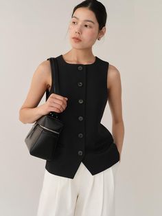 This vest exudes sophistication with its square neckline to add a modern touch and semi-slim fit, complemented by logo-engraved buttons for a branded look.- Cropped length that makes your look stylish- Made of a blend of wool fabric- Front pockets for added functionality Classic Vest With Hidden Button Closure, Modern Fitted Vest For Formal Occasions, Classic Workwear Vest With Buttons, Classic Workwear Vest With Button Closure, Classic Business Casual Vest With Buttons, Modern Black Fitted Vest, Modern Fitted Black Vest, Chic Business Vest With Button Closure, Modern Fitted Tops With Button Closure