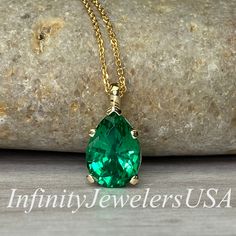 "The pendant pictured is a lab created green emerald #7033 -Approximate total carat weight: approx. 2.00ctw diamond equivalent -Center Stone Size: 10x7mm - approx. 2.00ct diamond equivalent -Center Stone Shape: pear -Gem Type: lab created Emerald -Stone Clarity: VS2 -Stone Color: Green -Moh's Scale: 9 hardness -Metal Type and Purity: 14k Yellow Gold -Setting: 5 prong -Chain: delicate 14k gold chain / heavier option with lobster claw available (use dropdown to select) -Country of Manufacturing: U Green Emerald Necklace, Pear Pendant, 14k Yellow Gold Necklace, Yellow Gold Necklace, Emerald Pendant, May Birthstone, Emerald Necklace, 14k Gold Necklace, Yellow Gold Setting