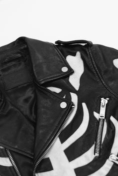 The SKELETON DEUCE BIKER Jacket is inspired by the original Perfecto Biker Jacket and embraces the rebellious attitude cultivated by its predecessor with an added contemporary edge. Cut in a perfected slim fit & crafted from a light weight, 100% lamb leather. Finished with signature hardware, a belted waist, shoulder vents and off white skeleton bones print.
 

The Sold-Out Skeleton Deuce Biker Jacket﻿ is available in limited quantities to purchase for. PRE-ORDER NOW. Black Skeleton Jacket, Skeleton Leather Jacket, Graphic Print Biker Leather Jacket, Skull Jacket Y2k, Skeleton Bones, Luxury Single-breasted Men's Biker Jacket, Signature Hardware, Black Shorts, Biker Jacket