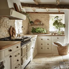 a kitchen filled with lots of white cabinets and counter top space next to a window