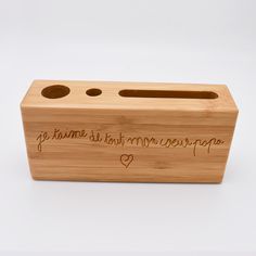 a wooden box with writing on it and two holes in the front that says, go home is just married