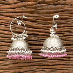 Pink Silver Jhumka Earrings. Height: 2.5 inch Width: 1.5 inch Handcrafted pair of earrings. Gives a traditional look. Can be worn for engagement and wedding parties.   Indulge in it or gift it and watch the compliments flow! It is advisable to store jewelry in a zip lock pouch (air tight pouch), keep away from water perfume and other chemicals and clean it with soft cloth. FREE SHIPPING!! Silver Bollywood Jhumkas For Eid, Bollywood Style Silver Jhumkas For Eid, Bollywood Style Silver Jhumkas, Bollywood Style Jhumkas For Festivals, Handmade Jhumkas For Diwali Festival, Heavy Jhumkas For Festivals, Heavy Chandbali Jhumkas For Festival, Traditional Pink Jhumkas, Bohemian Chandbali Jhumkas For Eid