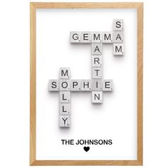 scrabbled crosswords in wood frame on white background with text the johnsons