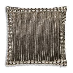 silver beaded pillow on white background