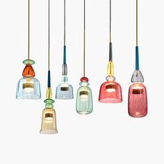 five different colored glass lights hanging from the ceiling