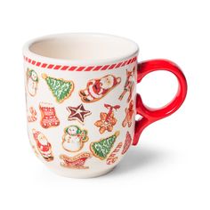 a red handled coffee cup with christmas decorations on it