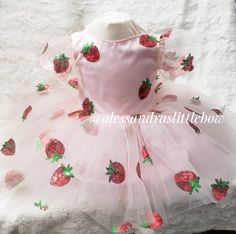 Vintage Strawberrry Dress All over sequined strawberry fabric, a modest neckline, a back bow and just enough poof. custom orders welcomed, if you would like a fuller skirt just send me a message for a custom, we also have an add on available on our main menu. Handmade to order Care instructions Handwash, or spot clean, hand to dry matching headpiece https://alessandraslittlebowco.com/products/strawberry-headband Baby Strawberry Dress, Strawberry Cake Smash, Strawberry Clothes, Strawberry Shortcake Dress, Strawberry Shortcake Outfits, Strawberry Fabric, Strawberry Outfit, Strawberry Shortcake Birthday, Strawberry Theme