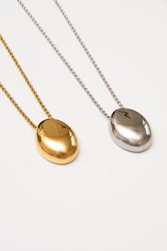 This minimal necklace has a mirrored finish with a high polish shine to add subtle sophistication to any look. Dimensions: Hangs 28" including pendant (1.25") (32mm) Materials: Stainless Steel, 18k Gold plating Ships in a branded jewelry pouch and box, perfect for gift giving! Modern White Gold Necklace With Shiny Finish, Modern Gold Chain Necklace With Polished Finish, Modern White Gold Tarnish-resistant Necklace, Pendant Chain Necklace With Polished Finish For Gift, Minimalist Polished Teardrop Pendant Necklace, Minimalist Teardrop Pendant Necklace With Polished Finish, Minimalist Polished Finish Teardrop Pendant Necklace, Modern Teardrop Pendant Necklace Tarnish Resistant, Modern Gold Necklace With Polished Finish