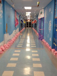 the hallway is decorated in pink and blue with snowflakes all over it,