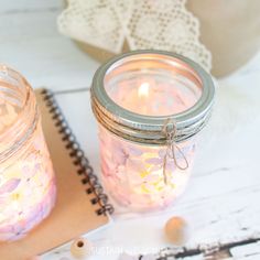 two mason jars filled with pink and white flowers