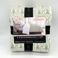 three piece queen quilt set in white and green damask with black trimmings