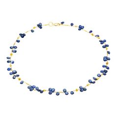 72 faceted blue sapphire briolettes create a delicate and feminine look with 18K yellow gold beads and chain. The blue sapphire beads looks like petals strung along a shiny golden path. Unique, artistic, one of a kind and the length is adjustable Luxury Blue Briolette Necklace, Luxury Sapphire Jewelry With Faceted Beads, Yellow Gold Briolette Sapphire Necklaces, Faceted Sapphire Briolette Necklace, Gold Sapphire Necklace With Faceted Detail, Faceted Briolette Sapphire Necklace, Gold Necklaces With Sapphire Briolette, Gold Necklaces With Briolette Sapphire, Blue Faceted Briolette Necklace