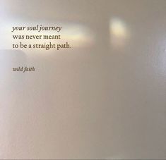 a white wall with a quote on it that says, your soul journey was never meant to be a straight path