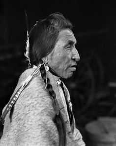 an old black and white photo of a native american man