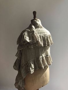 "This is a fantastic, generously sized linen shawl with an elegant ruffle along all sides. Made from gauzy, 100% pure natural taupe linen. Gorgeous texture and distinct wrinkling. Rustic texture combined with feminine styling. A great accessory that will prove itself a timeless value. The dimensions approximately 87\" x 31.5\" (220cm x 80 cm) The shawl will be pre-washed and won't shrink anymore. Care instructions: - machine washable in gentle wash cycle - preferably lukewarm water - straighten Bohemian Linen Shawl Scarf, Bohemian Linen Shawl, Linen Shawl, Shawl Wedding, Linen Scarf, Rustic Texture, Linen Scarves, Wedding Shawl, Women Shawl