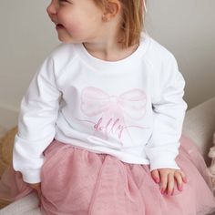 **Please double-check spelling! We can not change it once your order has been placed. Font is ALL lowercase.** If you have specific design requests - you MUST leave a note at checkout This sweatshirt is the perfect blend of style, warmth and personalization for your little ones! This snow white sweatshirt with a delic Baby Ballerina, Personalized Bow, Sweatshirt Details, Dry Air, Tiny Dancer, White Headband, Color Care, Gift Wrapping Services, Bamboo Fabric