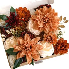 an open box filled with lots of flowers