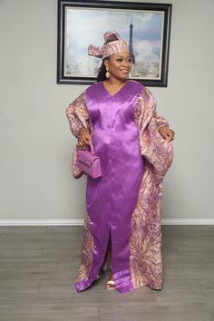 Make a bold entrance with this eye-catching Purple and Gold Kaftan Dress. Featuring a vibrant purple center with shimmering gold and purple patterned side panels, this dress is the perfect blend of luxury and style. The V-neckline and wide sleeves provide an elegant touch, while the matching headscarf completes the ensemble for a coordinated and polished look. Whether you're attending a special event or celebrating a formal occasion, this kaftan will ensure you stand out with confidence and grac Elegant Purple Festive Maxi Dress, Elegant Purple Maxi Dress For Festive Occasions, Elegant Festive Purple Maxi Dress, Elegant Long Purple Dresses, Purple Long Maxi Dress For Evening, Fitted V-neck Kaftan For Party, Elegant Purple Kaftan For Party, Elegant Purple Party Kaftan, Elegant Purple Evening Kaftan