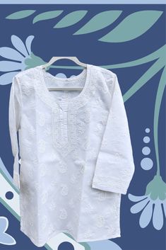 This gorgeous white tunic, hand embroidered Indian ethnic short top is a must-have for your wardrobe! Crafted from 100% soft artisan cotton, you'll love the luxuriously comfortable feel of this piece. The classic style, with its clean lines and subtle detailing, makes it perfect to wear dressed up or down - it's versatile enough to go from day to night in an instant. Such an essential piece for your capsule wardrobe. Available in plus size kurti to small size kurti. This unique and eye-catching piece is handmade with quality materials and features either sleeveless or long sleeve options, allowing you to customize it to your personal style. Whether you are looking to find the perfect gift or beach wear, or you're simply looking to bring a little extra mindfulness and serenity to your day t Luxury Cotton Top For Wedding, Cheap White Kurta For Festive Occasions, Luxury Classic White Kurta, Kurti Straight, Short Kurtis, Indian Kurti, Short Tunic, Short Kurta, Short Kurti