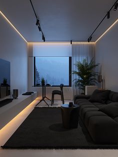 the living room is lit up with dim lighting and modern furniture, along with a large window