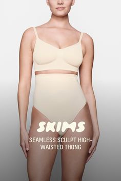 Wear this perfectly stretchy, shapewear high-waisted thong for a flat tummy and cinched waist without bulk or panty lines. Features a high waist fit that hits right below the bust, an interior silicone underband to prevent roll-down, a cotton gusset, and a wide crotch for added coverage. Fits true to size. | SKIMS High-Waisted Thong | Light Neutral | 2XS | Seamless Sculpt Flat Tummy, Cinched Waist, Shapewear, High Waist, Lounge Wear, High Waisted, How To Wear