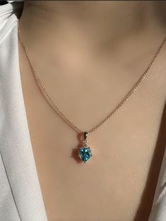 A timeless and classic design, symbolizing communication and compassion. Perfect for everyday wear or dressed up for special occasions. Add a pop of color with our Genuine Blue Topaz and Diamond Heart Pendant, available in 14k solid white gold and 14k solid yellow gold. This beautiful pendant features a heart shaped blue topaz gemstone accented with a sparkly diamond. 14k solid white gold chain and 14k solid yellow gold chain available for purchase to match your beautiful pendant. Item Specifica Blue 14k Gold Heart Pendant Jewelry, Blue Diamond Heart Pendant Jewelry, Sapphire Heart Pendant Necklace For Valentine's Day, Yellow Gold Diamond-cut Heart Pendant Necklace, Sapphire-colored Cubic Zirconia Heart Pendant Jewelry, White Gold Chain, White Gold Chains, Heart Pendant Diamond, Yellow Gold Chain