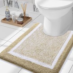 a white toilet sitting on top of a bathroom floor