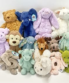 a pile of stuffed animals sitting next to each other