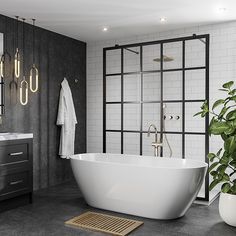 a white bath tub sitting in a bathroom next to a sink and shower with mirrors on the wall