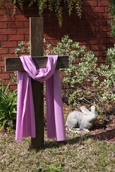 a cross with a purple cloth draped around it