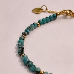 A testament to the serene embrace of a summer's sky, this beaded stacking bracelet captures the very essence of turquoise tranquility. Wear it alone for a subtle pop of color, or layer it with other pieces to craft your own personalized palette of shades. Its flexible design ensures comfort without compromise on style. Gold Plate 6.5" to 7.5" Adjustable Length Waterproof & Tarnish Resistant Nickel- & Lead-Free Turquoise Amazonite Beaded Bracelets As Gift, Hand-strung Amazonite Beaded Bracelets As Gift, Blue Beaded Amazonite Bracelets, Blue Beaded Amazonite Bracelet, Turquoise Amazonite Bracelet Gift, Turquoise Amazonite Round Bead Bracelets, Everyday Blue Amazonite Bracelets, Handmade Turquoise Amazonite Bracelets, Handmade Amazonite Round Bead Bracelets